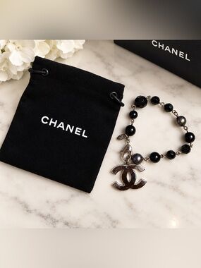 CHANEL Black Bead Bracelet with Silver CC Charm